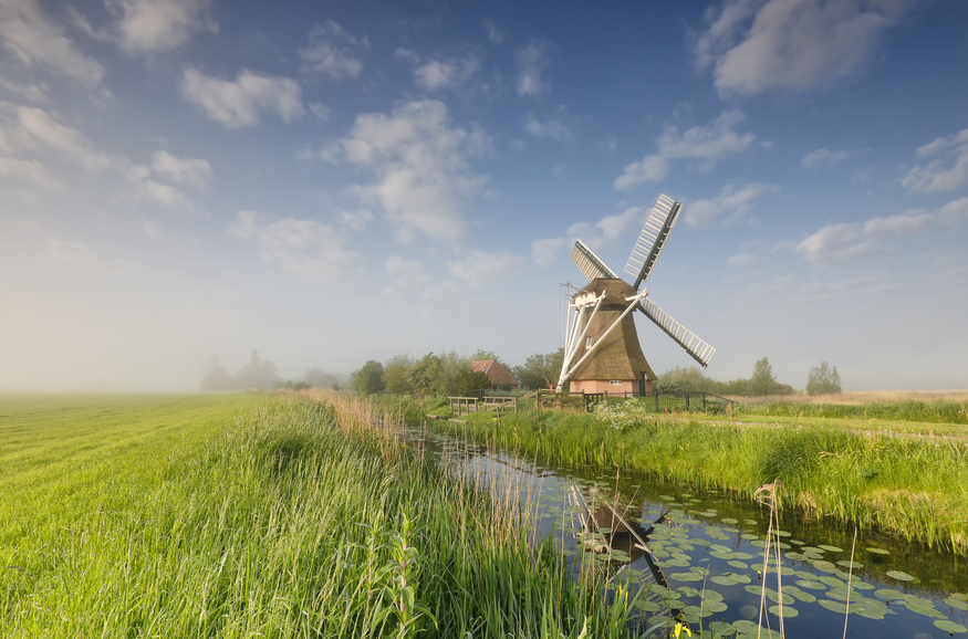 windmill-on-green-meadow-by-river-2022-02-02-03-48-07-utc-1.jpg